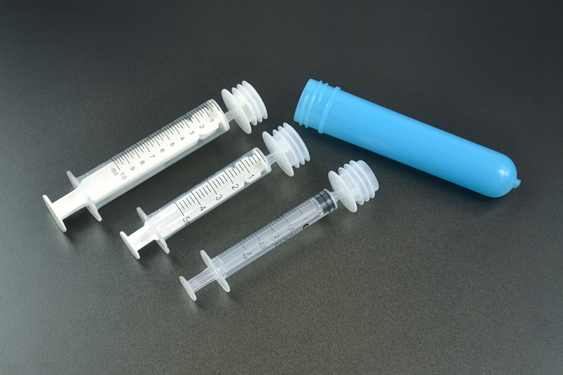 Oral syringe with adaptor